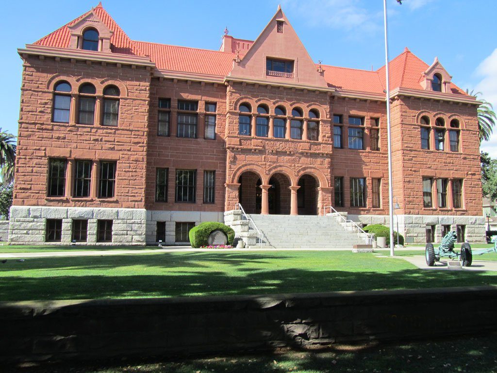 Red Arizona sandstone facade of the Old Santa Ana Courthouse