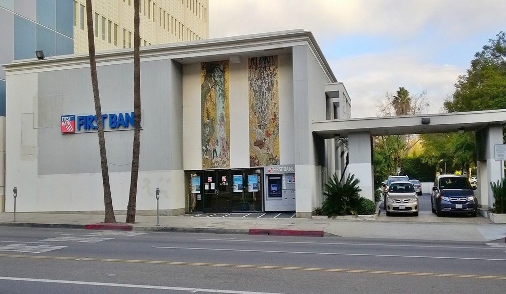 Marble veneer facade of the First Bank building during assessment