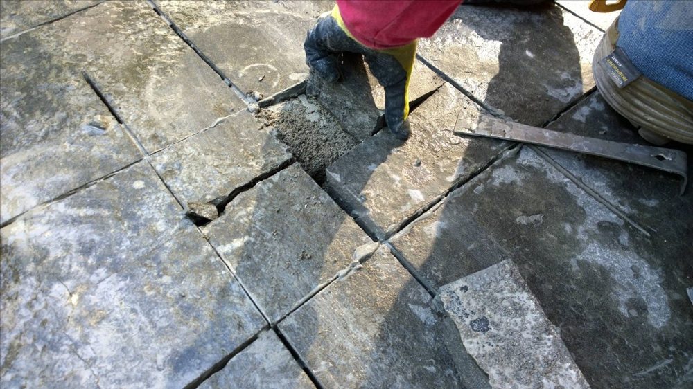 Stone installation detail during assessment